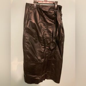 Black leather mid length skirt.Just needs ironing. Used once for Christmas party